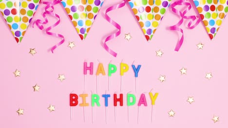 birthday party flag banners with ribbons move on pastel pink theme with happy birthday candles. stop motion