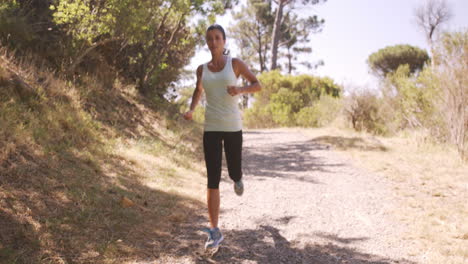 Woman-jogging-in-forest