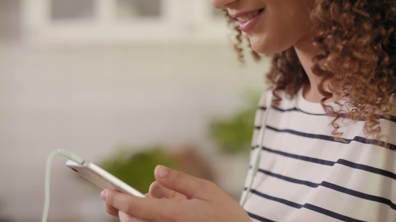 Tilt up view of young woman listening to music and singing/Rzeszow/Poland