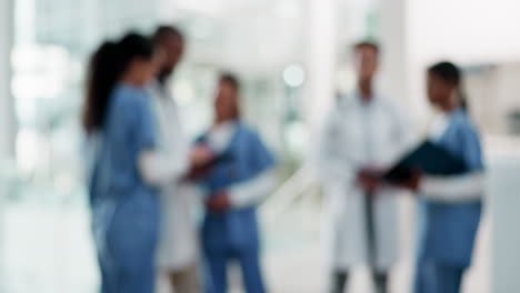 Doctors,-nurses-and-staff-talking-in-a-hospital