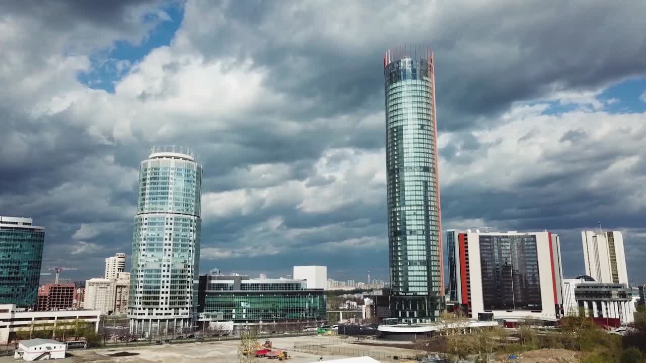 Modern City Skyline with Skyscrapers and Cloudy Sky