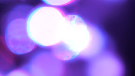 purple blurry light circles bokeh effect moving around