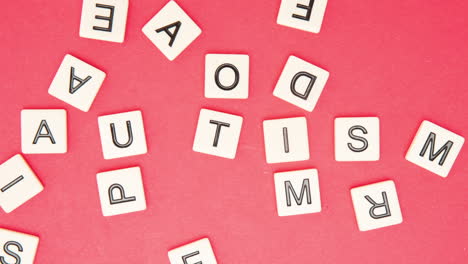 autism spelled out in letter pieces among many