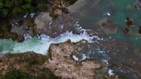 Powerful-water-cascading-over-canyon-in-Mexico,-rising-aerial-shot-4K