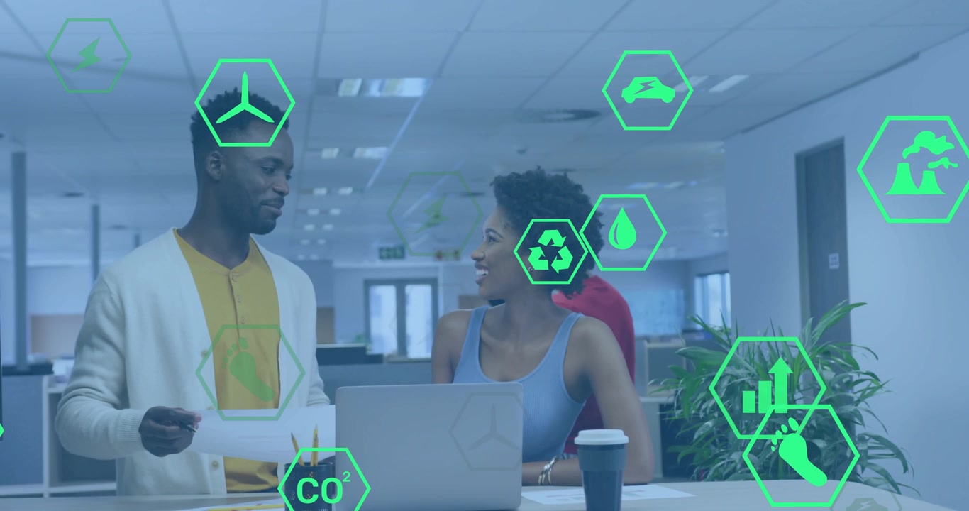 Man presenting printout at standing desk initiating hexagon icons updating energy recycling data