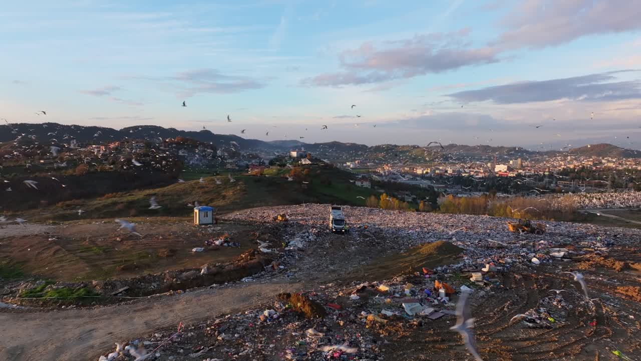 Drone scene of a garbage-filled wasteland spreading across the horizon