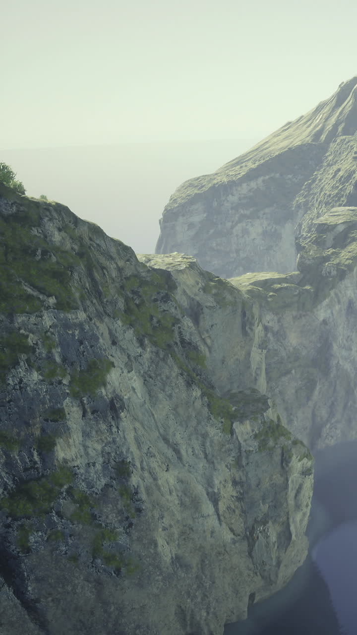 Scenic view of rocky cliffs by a large water body in soft light