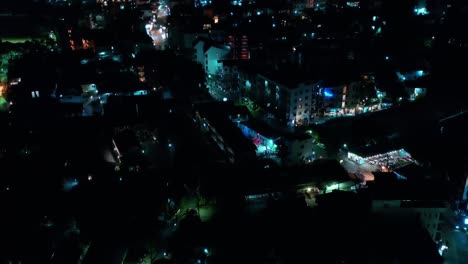 bright night time illumination with traffic in street