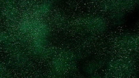 Close-up of a textured dark green surface with small white specks scattered over its rough exterior