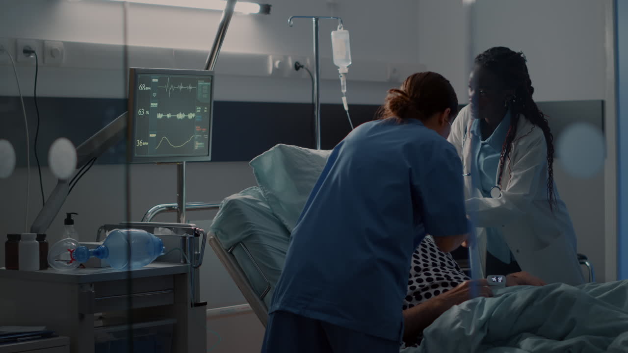 Patient with breathing problems in hospital ward bed