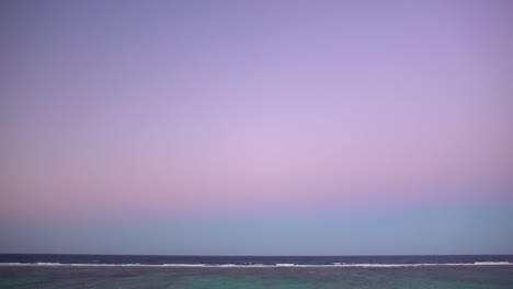 purple and pink sky glow at mauritius beach