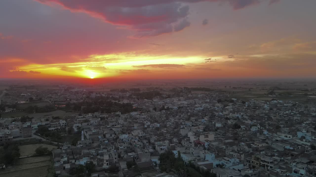 Drone flying over a village in Pakistan during Sunset, Sunset in Pakistan