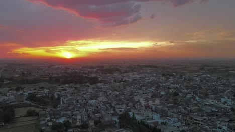 Drone flying over a village in Pakistan during Sunset, Sunset in Pakistan