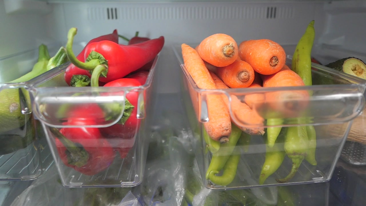 Fresh Vegetables and Produce Organized in Refrigerator Containers