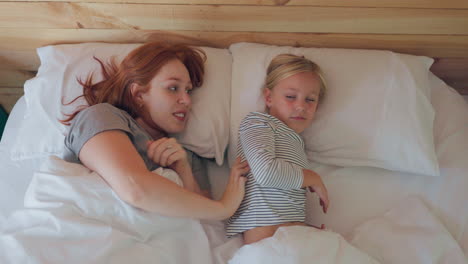 Bed,-wake-up-and-a-mother-touching-her-daughter