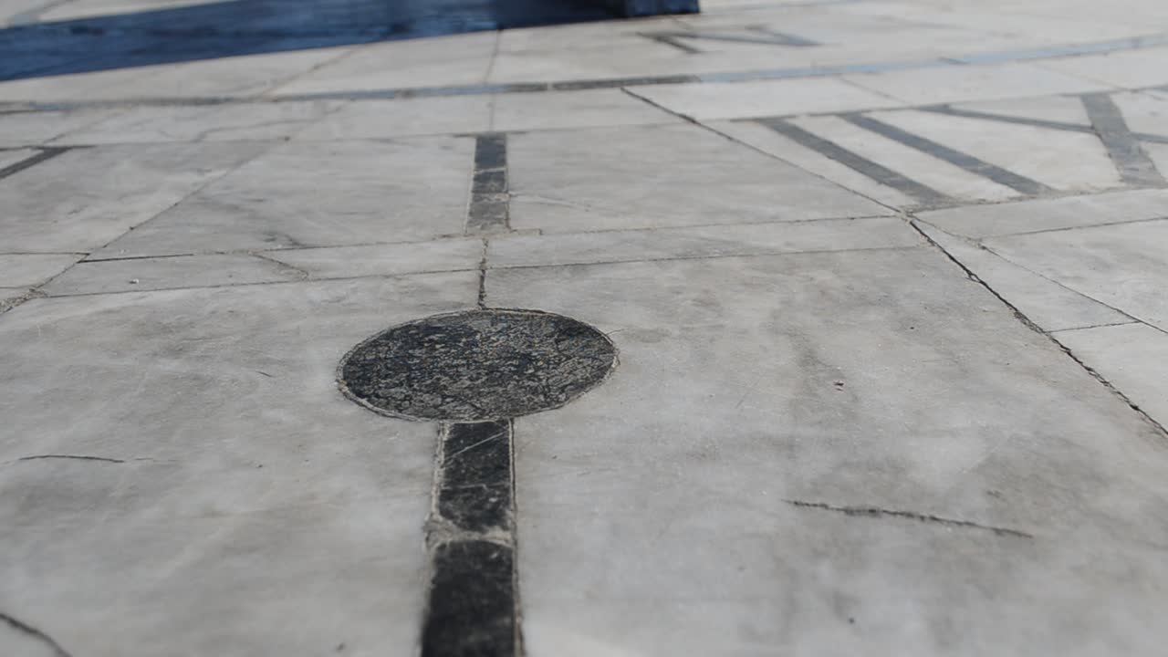 The shadow shows time. Sundial on marble