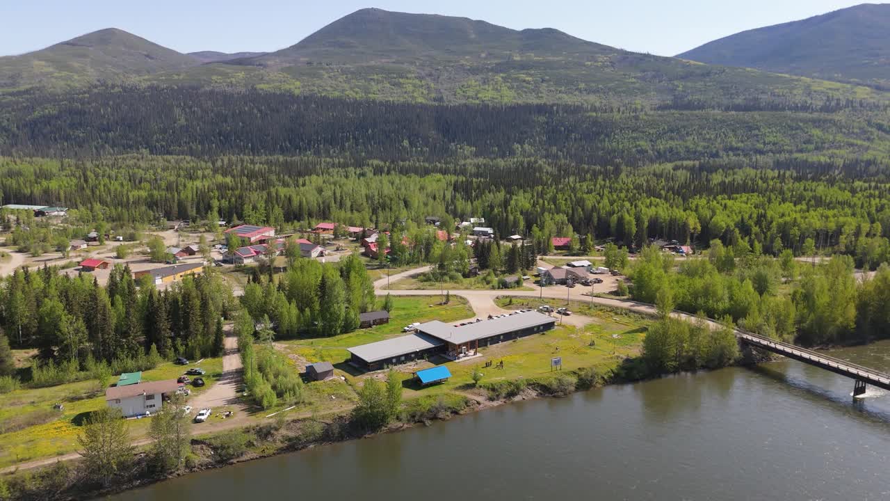 Drone footage of deforestation in the Canadian forest. River running next to the mountains in a village of indiginous tribes