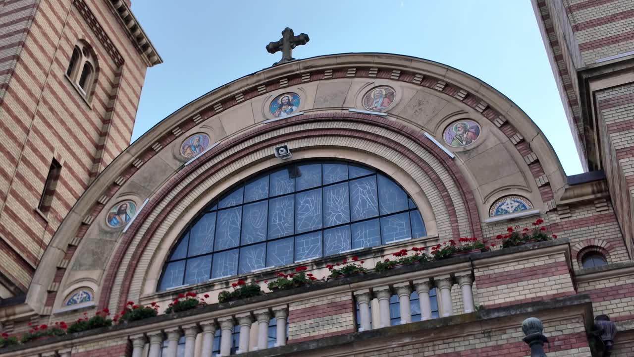 Close-up footage showcasing the intricate architectural details of the Holy Trinity Orthodox Cathedral façade in Sibiu, Romania