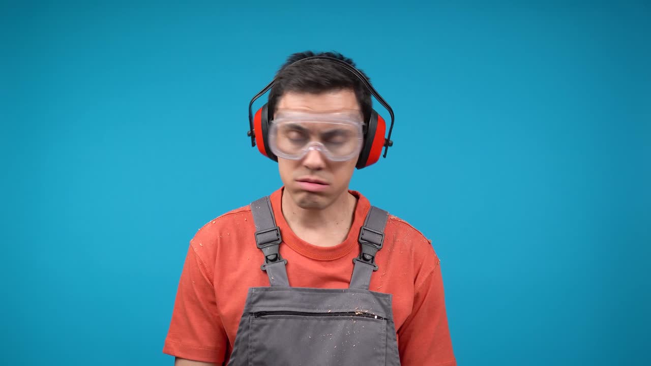 Worker Wearing PPE Looking Tired and Confused
