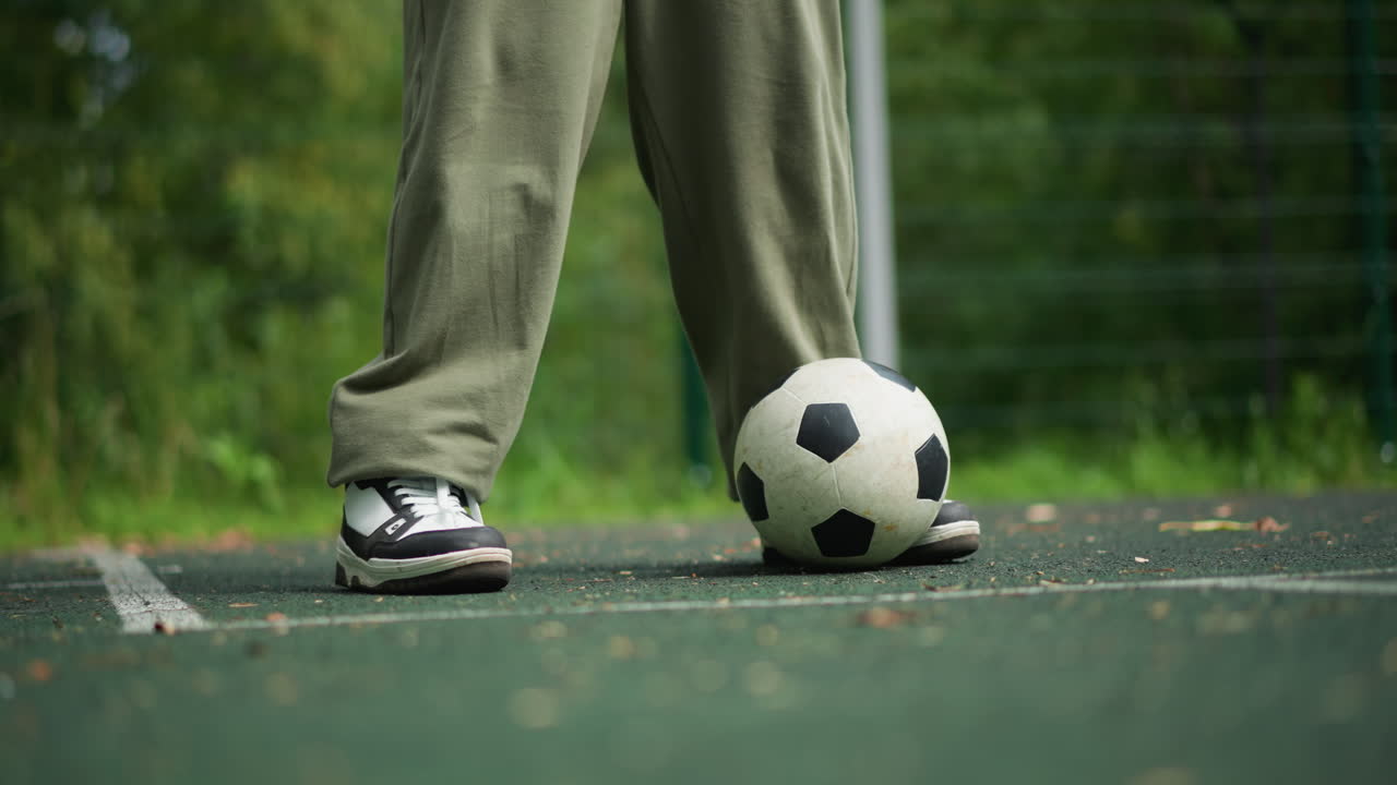 Boy Juggling Ball, Youth Performing Casual Soccer Tricks, Young Male Skillfully Handling Soccer During Leisure, Teenage Boy Effortlessly Balancing Soccer Ball Outdoors With Relaxed Movements