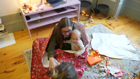 family unwrapping christmas gifts
