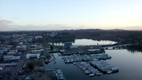 drone of pnw capital city downtown with marina