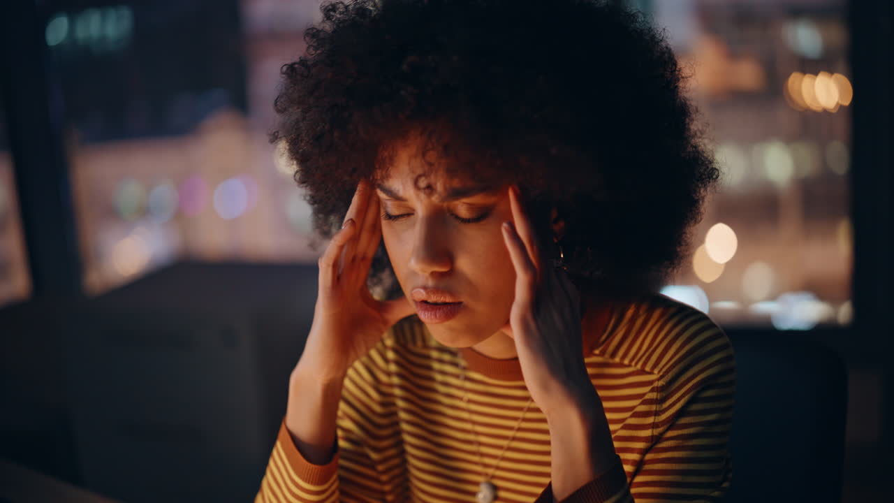 Overtime worker calling office frustrated phone conversation at night closeup