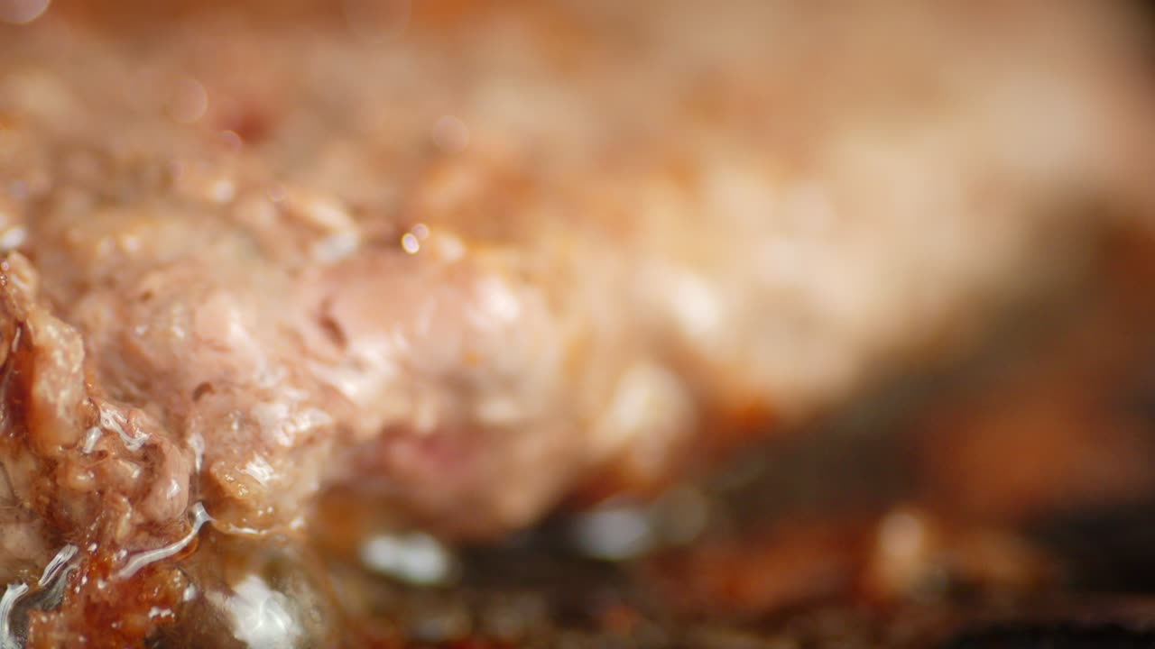 Fried burger meat is fried in hot oil.
