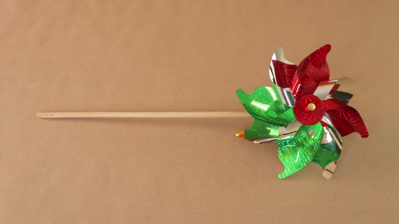Classic icon, traditional Windmill toy with mexican flag colors
