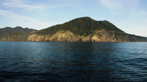 rugged cliff, mountain peak on oregon coast, view from pacific ocean