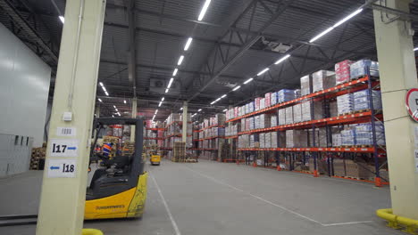 warehouse interior with forklifts and storage racks