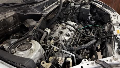 Close-up-of-the-engine-of-a-disassembled-truck-in-the-mechanical-workshop