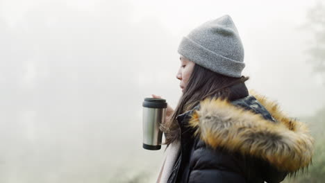 Hiking,-coffee-and-a-woman-in-the-forest