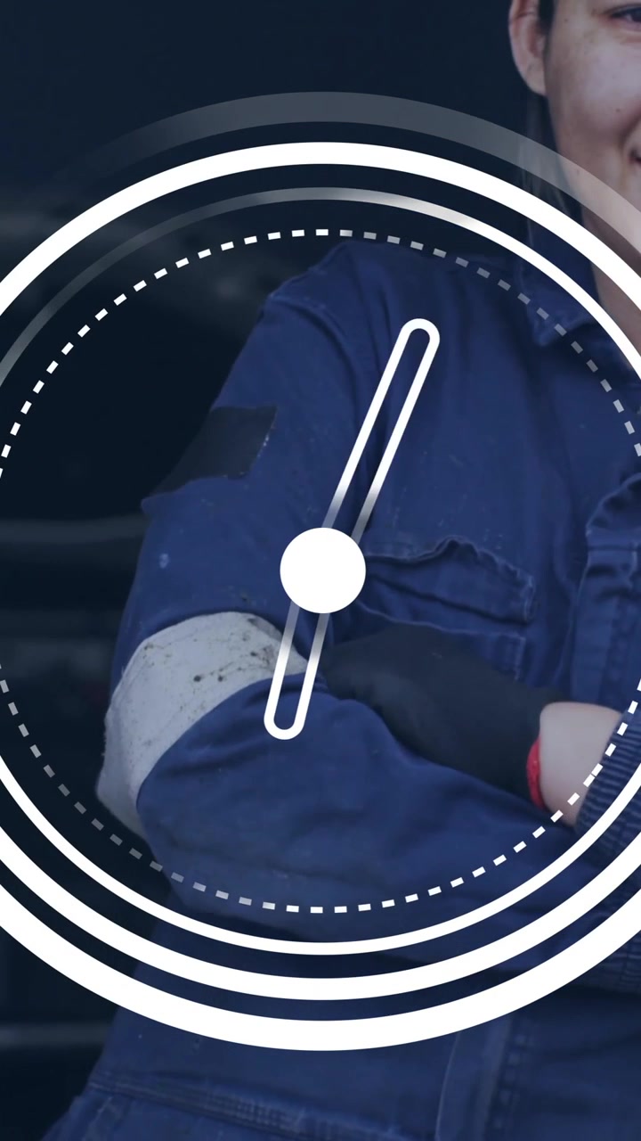 Mechanic in blue uniform smiling with clock animation overlay in workshop
