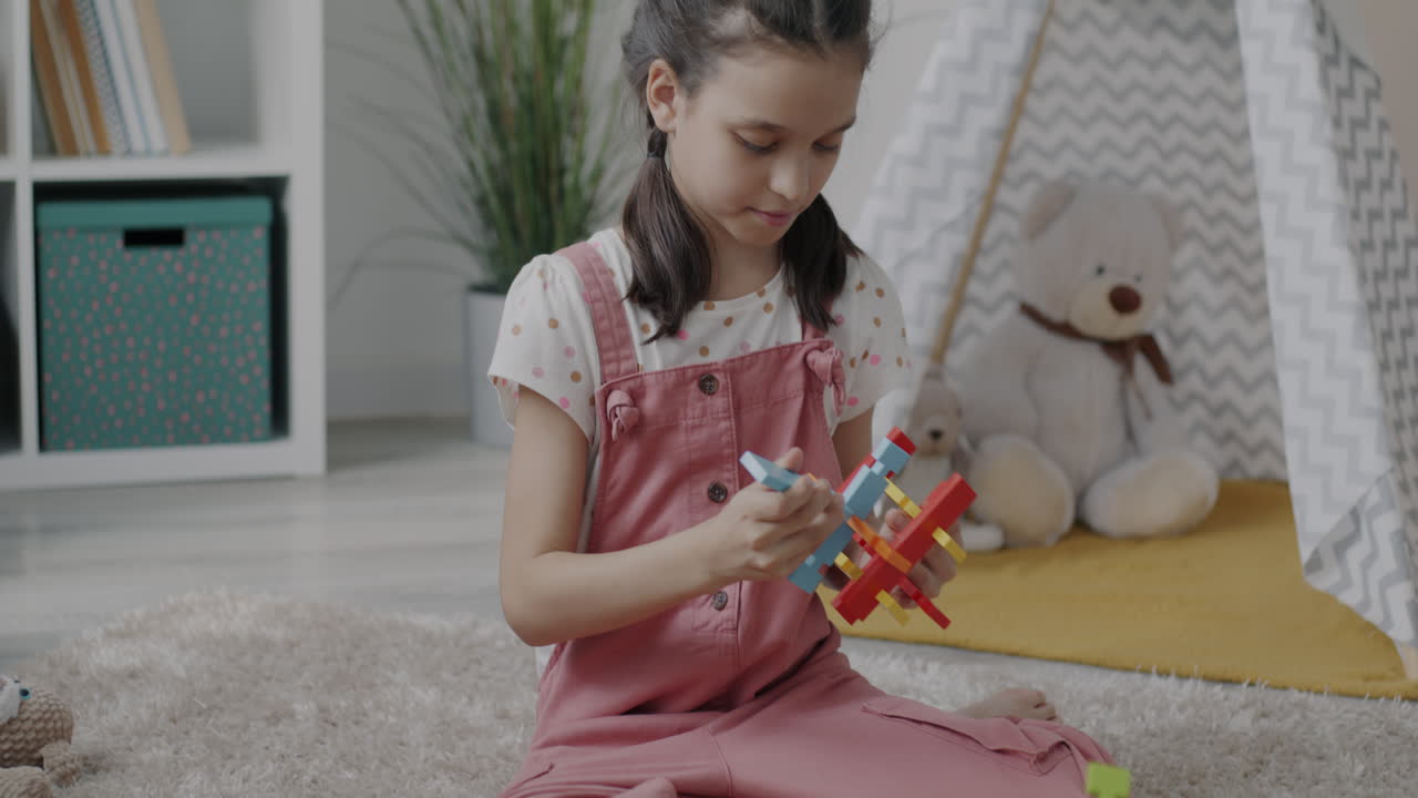 Child Playing with Colorful Puzzle Blocks