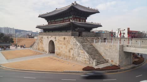 hwaseong fortress north gate interior view - korean name - janganmun,also known as bungmun - people and traffic time lapse