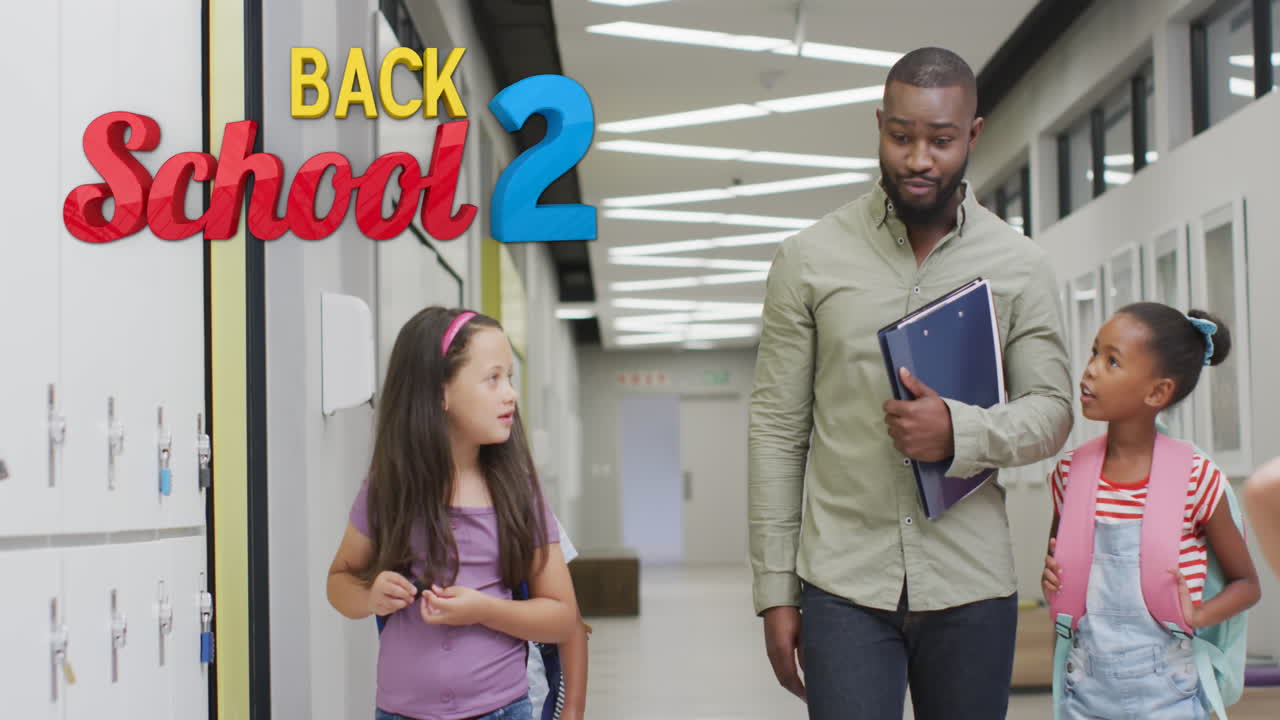 Animation of back 2 school text over happy diverse male teacher and schoolgirls talking in corridor