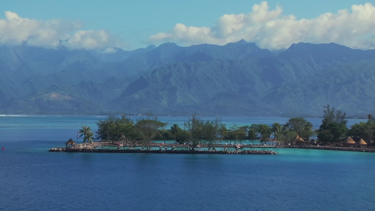 Tropical Island Paradise with Mountains in the Background