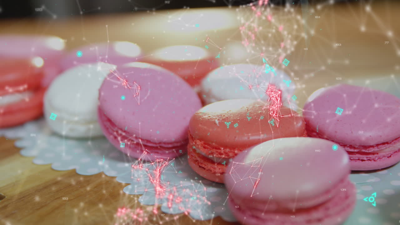 테이블 위에 놓인 분홍색 마카로니 위에 빨간색 떠다니는 연결망을 가진 파란색 qr 코드