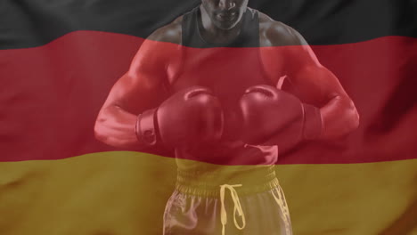 animation of flag of germany over african american male boxer