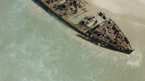 Drone-shot-of-the-abandoned-SS-Maheno-shipwreck,-washed-up-on-the-coastline-of-Fraser-Island-in-Australia