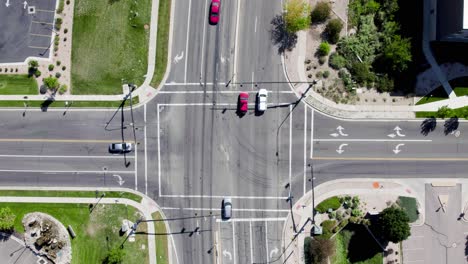 static aerial view directly above car traffic and road intersection