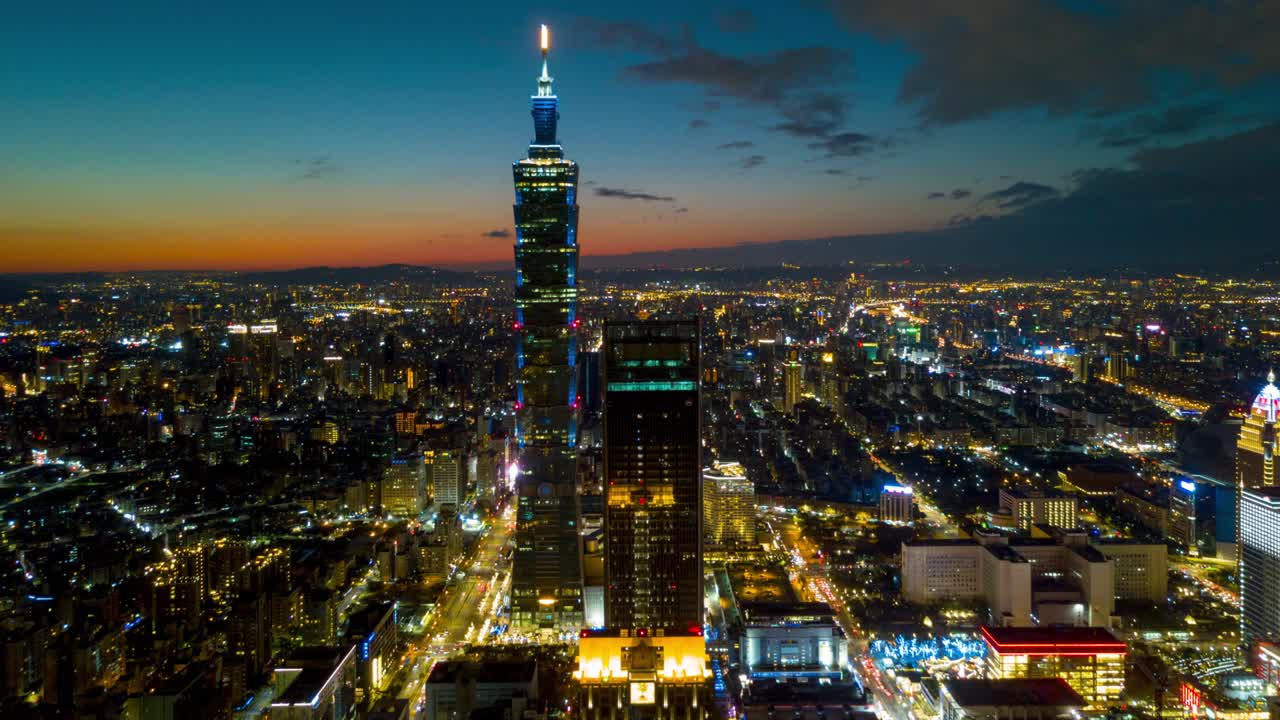 puesta de sol noche iluminada torre de taipei centro de la ciudad panorama aéreo 4k timelapse taiwán