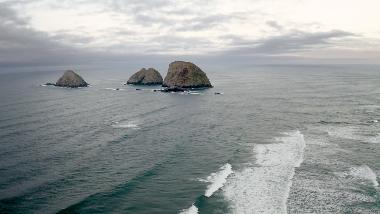 Scenic View of Sea Stacks and Ocean Waves under a Cloudy Sky