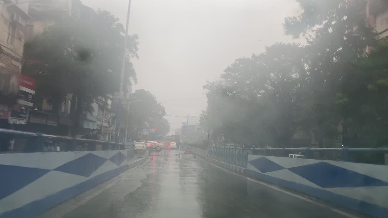 Kolkata, POV of yellow taxi during heavy rain in Kolkata in Monsoon season