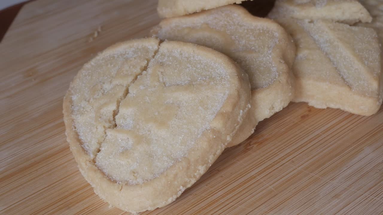 Closeup of buttery shortbread cookies on a wooden board, classic treat