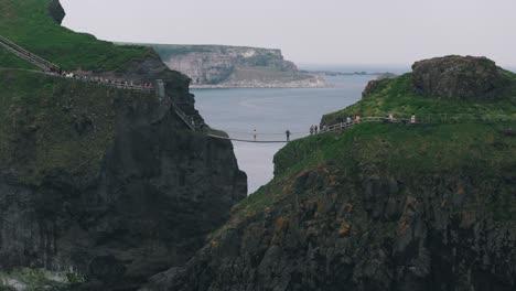 Circling-Shot-of-Carrick-a-Rede-Rope-Bridge-and-Cliffs