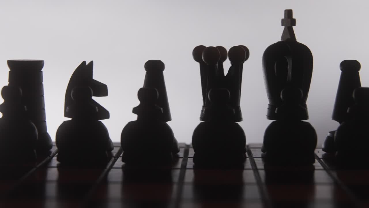 Chess Pieces Silhouette on Board