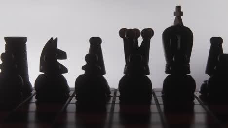 chess pieces silhouette on board