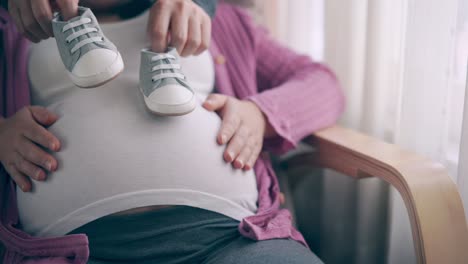 pregnant couple feels love and relax at home.